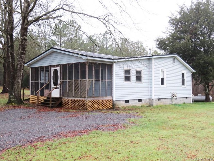 Great home that needs some TLC.  This home is 2 bedroom and 1 bath sitting on 36 beautiful acres.  The property is mostly hardwoods.  The Home sits at the front of the property and has large enclosed front porch and large utility room on the back.  There are a couple of sheds/buildings on the property.  Very private setting with plenty of potential.