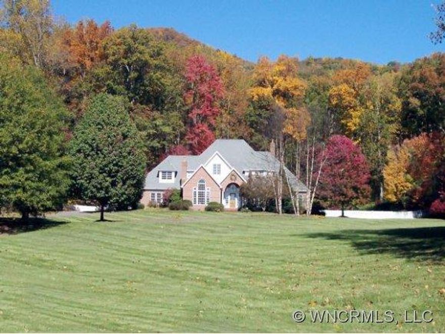 Convenient to downtown Asheville, this recently updated, spacious French Country style brick home has a great kitchen & open floor plan. The 50 acre setting includes level & rolling meadows and forest, a pond, hiking trails, & additional homesites, if desired, w/ beautiful views, along with a 24x60 RV garage & a 30x30 studio/workshop. (property is a portion of deed book & page)Taxes TBD