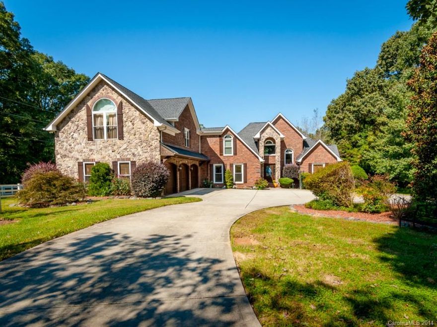Immaculate country living home located on over 5 acres! Horse lovers dream w/ 3 barns; A 4 stall barn w/ tack room, & wash bay, a 5 stall shed row, & 1 stall w/ storage. Vinyl fenced paddocks & riding arena. 1 MBR on main & 1 upstairs.  Upstairs MBR is a dream come true w/ computer area, sitting area including  fireplace, large master closet w/ built in shelves, fabulous bathroom! Large patio w/ fireplace, hot tub under the pergola, & in-ground pool.   Guest home included w/ 1 bed & 1 bath!