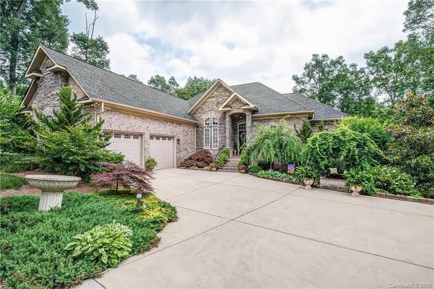 Reduced another $5000! Custom built home is a must see! Nestled in quiet deep water cove w/ 200 ft of shoreline on Lake Wylie. Two separate living areas! Gorgeous 11 1/2 ft ceiling BSMT, professionally decorated making Lake living easily accessible.  DCK and patio width of HME. Second full KIT, 2 BED/2BTH. Perfect for entertainment or INLW/teen retreat.   Gourmet KIT, MST suite & 2nd BED on main.Custom cabinets,GRNT, HDWD trey & vaulted CEIL, SS APPL. Unlimited quality throughout! Home Warranty!