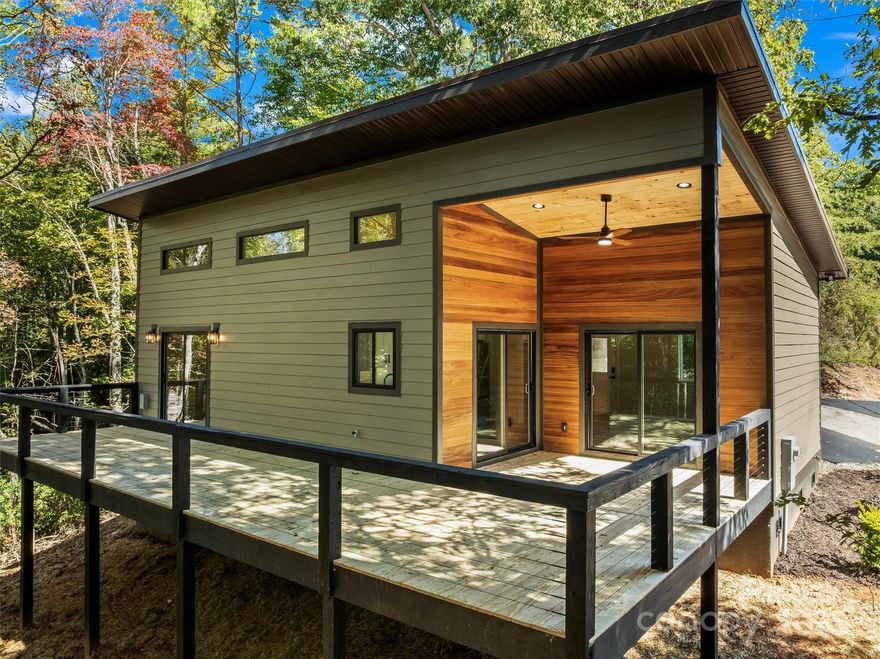 PRICED TO SELL! Perfect mountain retreat, 5 minutes from downtown Bryson City!  Nestled in a peaceful, wooded setting, this stunning 2-bedroom, 2-bath home blends luxury and mountain charm.  The open floor plan creates a bright, inviting flow from the high-end kitchen, complete with Kohler fixtures, granite countertops, and premium appliances, to the spacious living area that captures the beauty of the outdoors without ever leaving your living room.  The glamorous master bath offers a spa-like escape, combining elegant finishes with everyday comfort.  Step outside to nearly 500 sq. ft. of outdoor living space, perfect for entertaining, relaxing, or soaking in the fresh mountain air.  Located in Vista Reserve, a highly desirable boutique subdivision with paved roads and ample parking, this home delivers the best of both worlds: modern luxury and serene mountain living.  Due to the foam insulation, quality construction, and energy-efficient appliances, the water and power bills for a winter month are less than $3.00 per day!