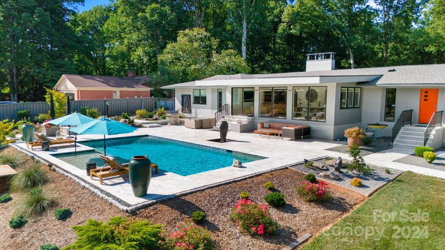 Luxurious one-level living with outdoor entertainment in highly desirable Kingswood. This 2-car garage home on a corner lot has undergone full renovation/expansion, including a fully encapsulated crawlspace in 2022. Architecture by Liquid Design and interior design by Scott Carpenter. NEW ROOF, HVAC, PLUMBING, ELECTRICAL & TANKLESS W/H. Upon entry, you are greeted by the charming oak floors and abundant natural light streaming through all new windows. The three-sided glass modern fireplace with custom quartzite hearth seamlessly integrates the family room, dining area, living room, and kitchen into one open-flowing floor plan. Wolf/Sub-Zero kitchen features glass tile backsplash and a quartzite island with ample bar seating and storage. Two powder bathrooms located on both sides of the house. Gracious owner suite overlooks the show-stopping backyard with endless outdoor entertainment - cantilever porch, heated saltwater pool, built-in grill/firetable, and more! Minutes from South Park.