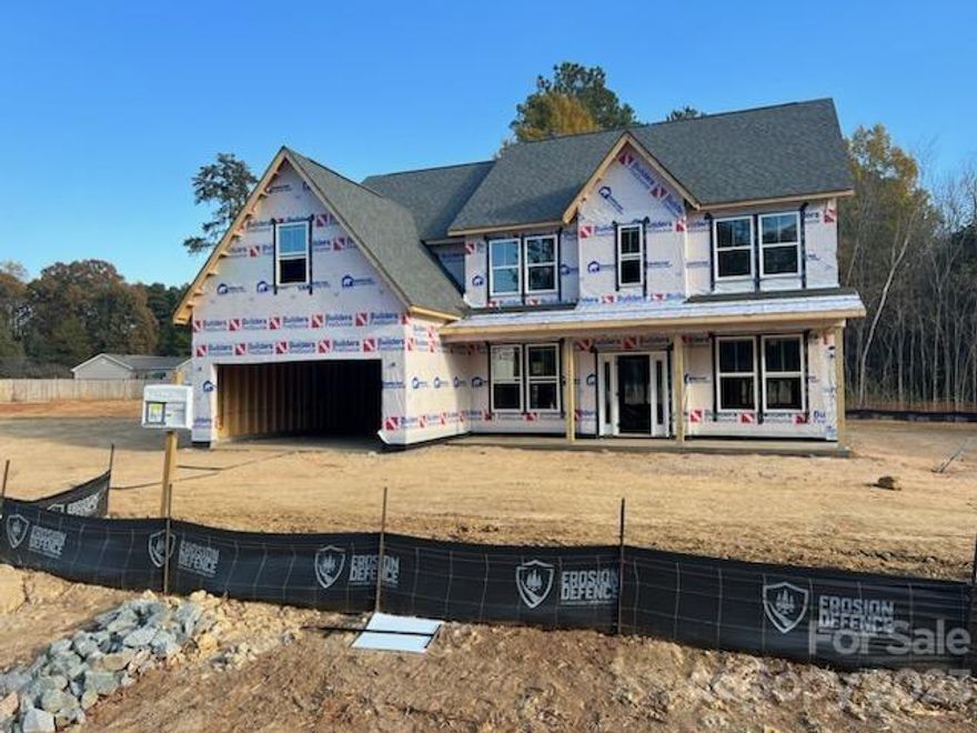 Stunning NEW HOME!!! Our Most Popular Modern Farmhouse elevation with large rocking chair front porch and stone and metal roof accents. All the most sought after features like gourmet kitchen with large island, quartz countertops and built-in stainless steel appliances. Primary bedroom boasts large bath with garden tub and walk-in shower with seamless glass enclosure.  Flex Room downstairs and a full bath. Large Bonus Room for you to enjoy. Great entertaining and privacy on the covered back patio. Convenient to shopping, restaurants, schools and interstates.