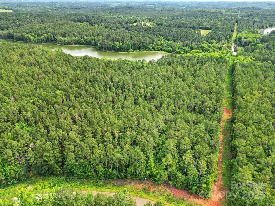 Beautiful Mountain Lakes is waiting for your new home! The perfect place to build your permanent residence or a weekend getaway spot. Situated between Charlotte and Columbia, and only 10 minutes from downtown Chester, ensures that you can get away without ever having to be away. This lot enjoys waterfront views, and a beautiful state maintained nature trail. County has a 100' easement off the edge of the water for maintenance of the walking trail, as well as for wetland and wildlife conservation. Lots are dock-able with permission from the county. Watercraft are allowed on the water as long as they are not gasoline powered. All potential homesites around the lake have been decided, so once they are gone they won't come back! Seize the opportunity to build your dream lake home while you can!