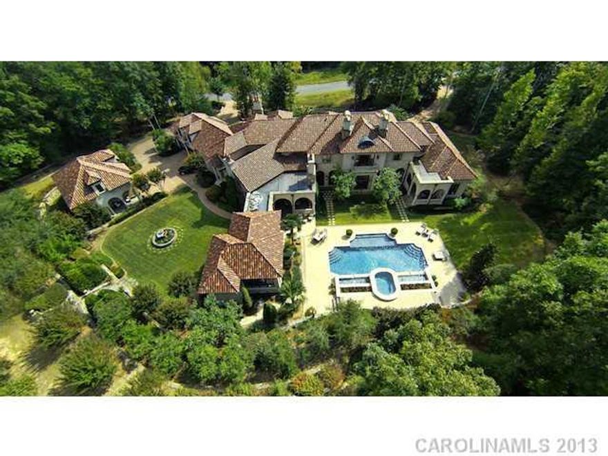 Definition of EXQUISITE!!! A true Mediterranean masterpiece estate unlike anything else. Estate is located in a gated & prestigious community w the utmost privacy in mind & 5 mi from Ballantyne, Stonecrest. Nestled on 5 acres, at 10,000 sq/ft on 2 floors, plus guest house. 6 bed, 7 full, 2 half baths, huge kitchen w two islands, 4 Wolf ovens, SubZero, full bar, wine cellar, walnut & travertine flrs, pool/spa, exercise gym, dry sauna, steam shower, 5-car garage. It's a must see!