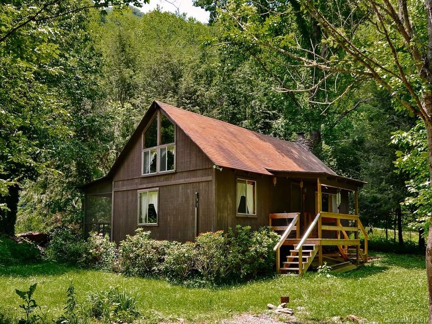 Cozy vacation cabin located in charming community. Level lot with room for gardening and just steps away from relaxing Cattail Creek. Welcoming great room with stone fireplace for those chilly mountain evenings. Home is being offered with all furnishings. Just 15 minutes outside of quaint Burnsville and within a hour of Asheville