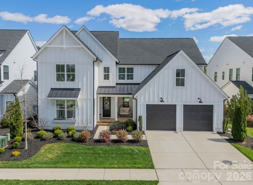 Welcome home to a picture-perfect retreat in the Arden Mill neighborhood of Fort Mill, where timeless Southern charm meets refined modern living. This beautifully crafted Napa Model by Classica makes an unforgettable first impression with its soaring two-story foyer, gracious formal dining room, and a private study perfectly suited for quiet mornings or inspired afternoons. At the heart of the home, the main living space is designed for gathering and entertaining. The chef’s kitchen is both stunning and functional, featuring luxury cabinetry, an oversized island ideal for casual conversations, a six-burner gas range, and a built-in wine refrigerator. It flows effortlessly into the living room, where vaulted ceilings and thoughtfully curated designer lighting create an atmosphere that feels both elevated and welcoming. The 12-foot sliding glass door invites the outdoors in, opening to a show-stopping lanai with vaulted ceilings, skylights, built-in heaters, and an electric retractable screen—perfect for year-round enjoyment. From here, step onto the paver patio and discover your own private oasis: a heated saltwater pool, a built-in gas fire pit, and a uniquely large backyard that is a rare and treasured find in Arden Mill.

The primary suite, conveniently located on the main level, is a serene escape. The spa-inspired bath offers dual vanities, a soaking tub, and a generously sized tiled shower, while the exceptional walk-in closet—with direct access to the laundry room—adds everyday ease to luxurious living. Upstairs, four additional bedrooms with walk-in closets, three full bathrooms, a spacious bonus room, second laundry room, and ample walk-in storage provide room to grow, gather, and relax. Perfectly positioned just minutes from shopping, dining, and Fort Mill’s award-winning schools, every detail of this home has been thoughtfully considered, creating a seamless blend of comfort, elegance, and functionality.