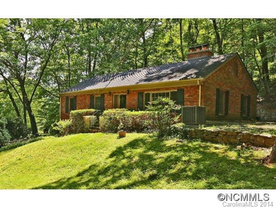 Wonderful and well cared for 3BR/2BA Classic Brick Rancher located at Waynesville Country Club. Features eat in kitchen, formal dining and living rooms, fireplace in living room, ceramic baths, large master with golf course views, hardwood floors under carpet in bedrooms, lower level family or recreation room with fireplace, 2 car garage, workshop area, spacious basement bonus room, back porch patio area, and nice yard. Don't miss this classic.