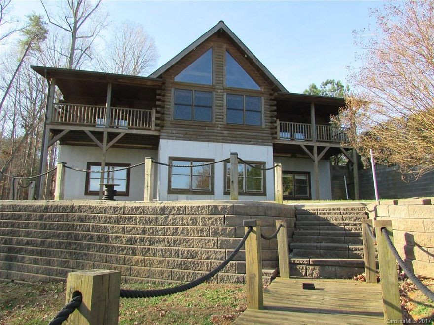 Log cabin home on Lake Norman with amazing views. Bright open floor plan w/ beautiful pine floors on main level. 3 bedroom/ 3 bath. Den/office space on main floor. Master suite and second bedroom include private covered balconies overlooking the lake. Master bath includes separate shower and jetted tub. Split floor plan. Garage in basement with plenty of storage for all your lake toys.  Basement could be a separate living area. No HOA, plenty of parking for campers, boats, jet skis.