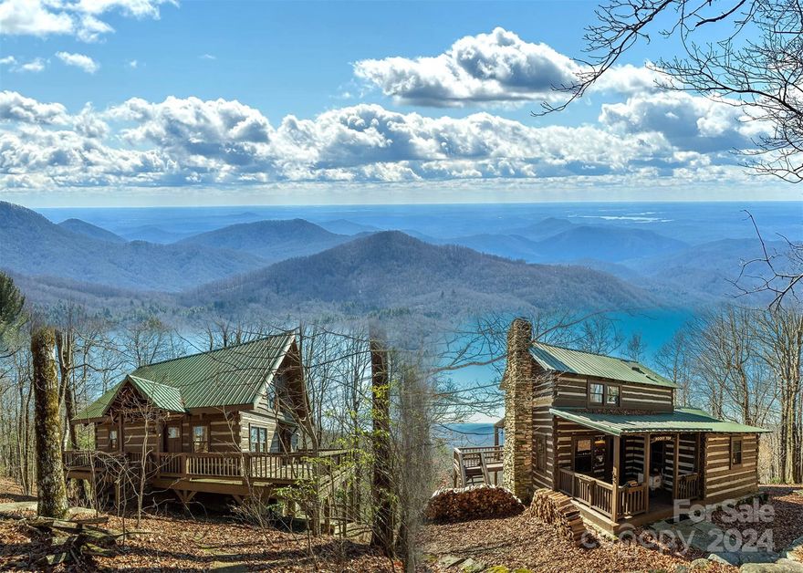 Perched on top of the Blue Wall, the famed escarpment where the Blue Ridge Mountains fall away to the South Carolina foothills, these two charming log cabins have amazing long-range views of mountaintops as well as foothills, with Lakes Keowee and Jocassee shining in the distance. Cozy and comfortable, the main cabin and guest cabin each have their charms: hardwood floors, warm wood paneling, exposed beams, stone accents and generous porches and decks. Modernized luxuries include tiled walk-in showers and updated kitchens. The main cabin features a large stone fireplace and hearth, while the guest cabin benefits from a great room, lofted sleeping area with king bed, and a stone-hearth wood stove. The privacy, peacefulness, and views offered by these cabins provide the perfect opportunity for true mountain living. 
Video at: https://tinyurl.com/mpe5yf3y
3D Walkthrough, Main  Cabin: https://tinyurl.com/mr2438wy
3D Walkthrough, Guest Cabin: https://tinyurl.com/2s3ra4am