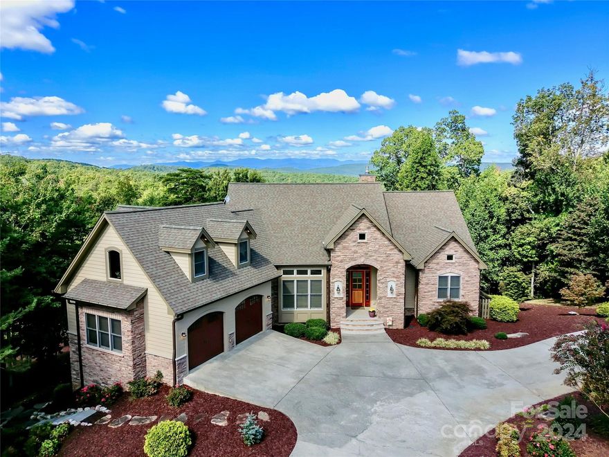 ABSOLUTELY STUNNING Grandview Peaks home!   Donald Gardner designed home with a craftsman flair, overflowing with curb appeal and offers easy living. The interior is immediately welcoming with a large open foyer looking through the expansive great room to a wall of windows bringing in natural light and panoramic views of the Blue Ridge Mountains. The main level consists of the Great room/Kitchen/Dining/Private Primary BR Suite/Garage/Screened Porch/Covered Porch/Additional BR/Office/Laundry/Mud room & Bonus room over the garage.  The lower level offers a Den/2 additional BR Suites/Recreation area & lots of storage.  Extra detached garage/workshop on property.  Property comes with 3 lots totaling 12 acres.