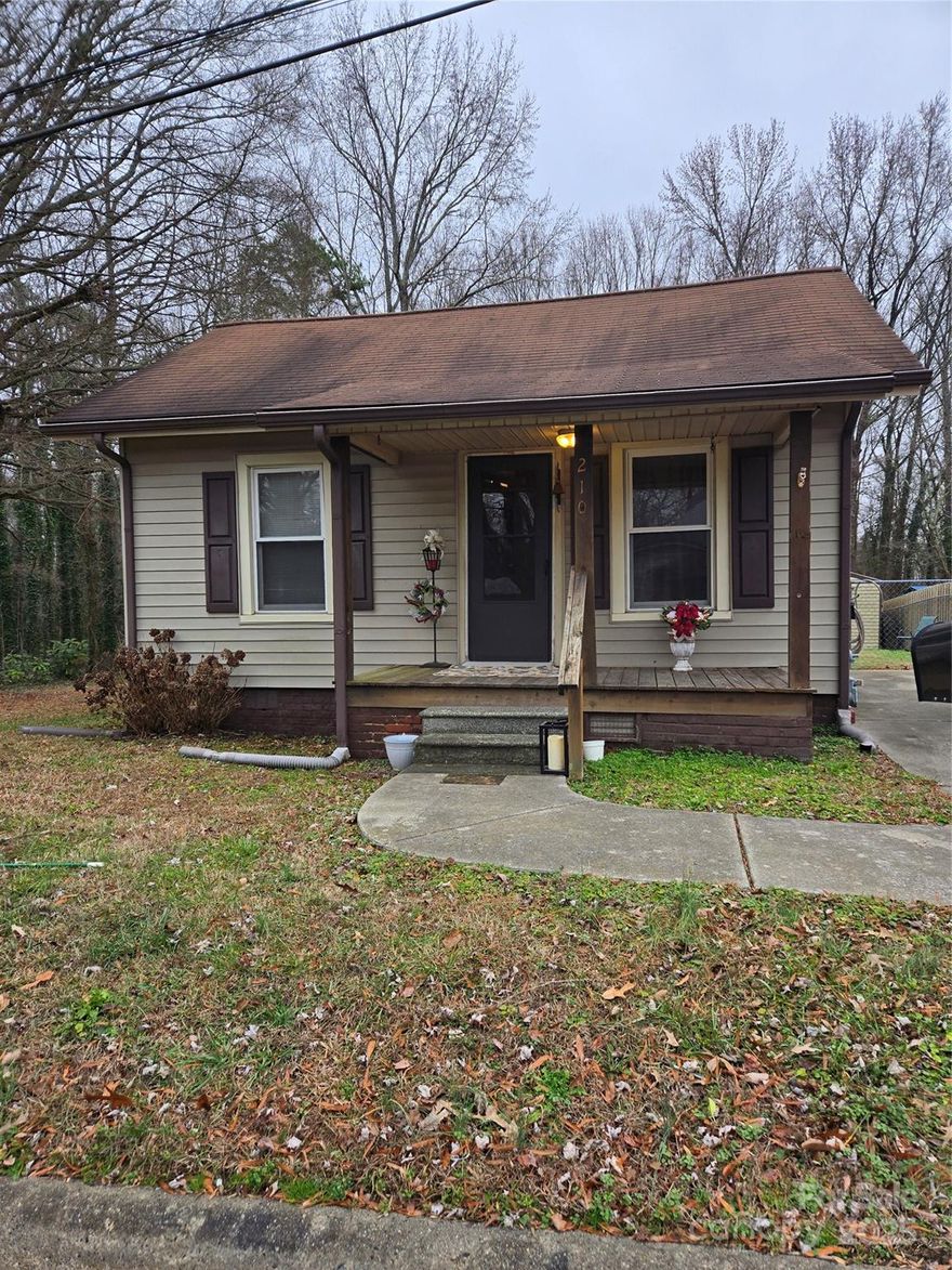A must see. This charming 2 bedroom 1 bath bungalow features a  fenced in back yard and  two large storage buildings. With a large and private fenced back yard,  great for dogs or just chilling after a hard day.  Located conviently within walking distance to downtown Landis and only blocks from the Landis Pool, this area of Rowan county is convienient to hwy 29 and I85 giving access to shopping, dining and entertainment.  A great investment to personnalize and make your own.