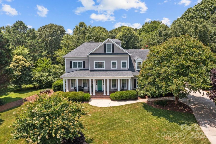 Nestled in the heart of Davidson, this exceptional home offers the rare opportunity to live just a short walk from charming shops, top-rated restaurants, and Davidson College. Thoughtfully designed with quality craftsmanship and superior finishes, this residence seamlessly blends character and modern convenience.  Inside, you’ll find an inviting open floor plan with abundant natural light, custom millwork, custom wine cellar, and hardwood flooring throughout. The chef’s kitchen features a large quartz island, subway tile backsplash, and custom light fixtures—perfect for entertaining. The coffered ceiling great room serves as a stunning gathering space, while the spacious primary suite boasts a luxurious en suite bath.  Step outside to enjoy the serene backyard, complete with a custom saltwater pool, exquisite decking, and professionally designed landscaping. Additional features include a two-car garage with epoxy flooring, ample storage, and a beautifully designed outdoor living space.