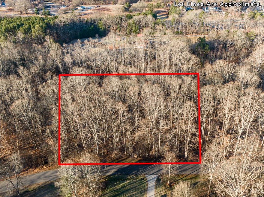 Lovely wooded 1 acre lot located in Spicewood subdivision in Troutman.  Private location, but convenient to down town Troutman, major highways and minutes to Lake Norman.