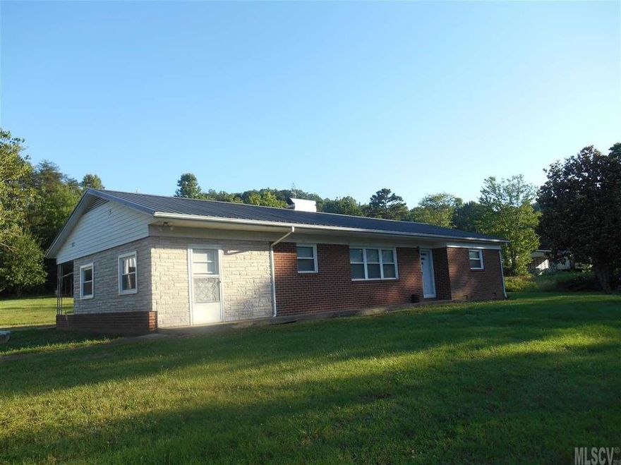 GREAT PROPERTY AT GREAT PRICE!  THIS PROPERTY INCLUDES 3.52 ACRES WITH LOTS OF TREES, 2 LARGE GARAGE BUILDINGS, AND BRICK RANCH HOME WITH 2 BEDROOMS, 1.5 BATHS, FIREPLACE, LARGE LIVINGROOM AND UTILITY/MUD ROOM WITH LAUNDRY. BEDROOMS HAVE HARDWOOD FLOORS. CONVENIENT LOCATION IN CAJAHS MT WITH NO CITY TAX. ALL FOR $115,000!