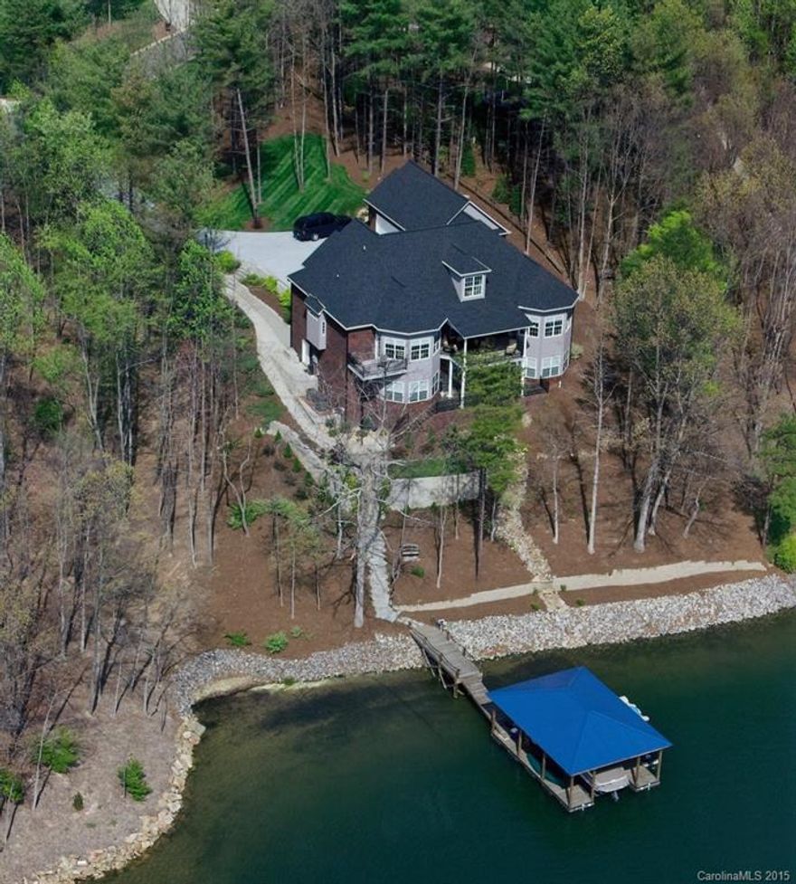 Stunning waterfront home w/ exquisite detail & craftsmanship.  Chef’s kitchen w/ heated floors & island w/ eat-in area. Great Room w/ sunset views of LKN & privacy from neighbors. Master bath has heated floors, oversized tub & separate shower w/ multiple heads His/hers walkin closets.  Entertaining Lower Level w/stone fireplace, kitchen w/ bar (Sep Living Quarters).  Outdoor entertaining +covered sitting areas & hot tub. Covered dock w/ sundeck area & boatlift, 100+' WF. Auto Enthusiasts garage.