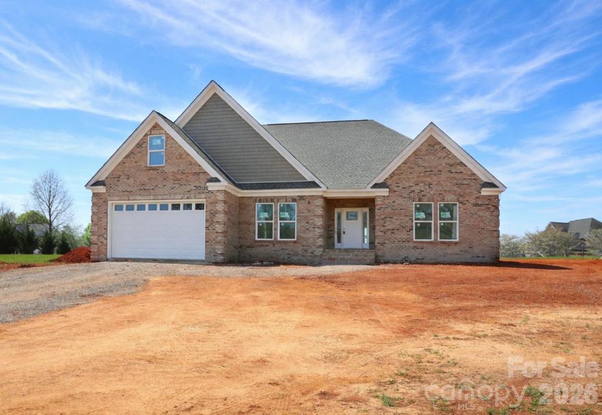 Unique opportunity for a NEW custom-built home with 4 bedrooms and 3 full baths on the main level and a Huge Bonus Room with a 4th full bath over the garage on a beautiful 1.24 lot. A spacious foyer welcomes you and connects the dining room with custom trim work to the open Living Room with gorgeous stone fireplace (not shown in illustrative pictures!). Beautiful open Kitchen with vent hood over electric cooktop, combination microwave/wall oven, dove-tailed drawers with soft close, and quartz counters. Ample counter space including perfect coffee bar with open shelving next to expanded pantry. Refrigerator provided! Laundry room conveniently located off kitchen and garage entry. Primary Bedroom enjoys views of the spacious rear yard. Beautifully tiled Primary Bath with dual vanity, walk-in closet, and rain shower! Two secondary Bedrooms on the main level share a Hall Bath while the 4th Bedroom has a private ensuite Full Bathroom. Bonus Room is spacious! Don't miss the convenient 4th Full Bath off the Bonus Room and walk in attic space. Step outside to a large covered porch with tongue and groove ceiling overlooking the rear yard! Mature trees along the front of the property provide privacy and a privacy fence will be installed along the right side of the property along the right of way easement (see survey for complete details). LVP throughout main except for tile in bathrooms. Carpet on stairs and in Bonus Room. New well has wonderful water pressure at 40 gallons/minute! Layout views are computer generated for illustrative purposes so colors may not match exactly.