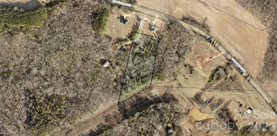there was a house here, but it burned down. County water and septic is installed but buyer should the septic checked to make sure it is still working. Small creek in the front. owners did have to carry flood insurance.