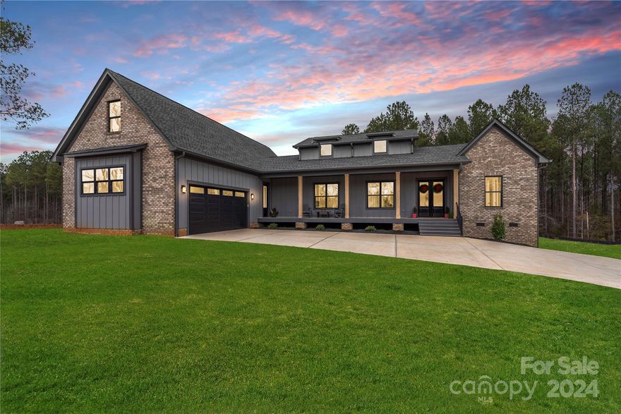 Discover this stunning new construction modern farmhouse on over an acre of serene land.The living room impresses with soaring 20-foot ceilings, while the first-floor primary suite offers 16-foot ceilings, a custom-built walk-in closet, and a spa-like ensuite featuring a standalone soaking tub. Each additional bedroom includes spacious closets, and the kitchen boasts a luxurious gas cooktop, a large island, and a walk-in pantry with built-in shelving. This 4-bed, 3-bath home includes an upstairs bonus room, ideal for a home office, guest space, or playroom. High-end finishes shine throughout, including stunning 8-foot doors that add a sense of grandeur.
The expansive back deck is perfect for entertaining or relaxing, with seamless indoor-outdoor flow. With over an acre of land, there’s plenty of room to create your dream outdoor space. The builder can offer more Customizable features making this home uniquely yours.