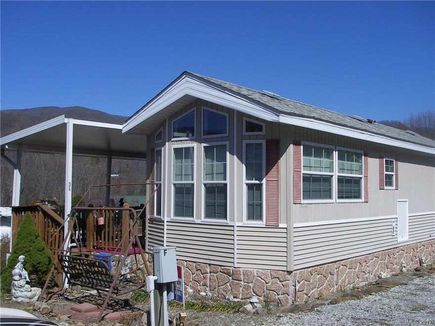 CUTE AS CAN BE! WELL MAINTAINED "TINY HOUSE"..CONVENIENT LOCATION WITH EASY ACCESS TO ALL MAGGIE VALLEY HAS TO OFFER!!SIT ON THE  ROCKING CHAIR PORCH AND ENJOY THE ASTOUNDING VIEWS.. SINGLE BEDROOM AND KITCHEN AND LIVING AREA IN MAIN UNIT. ADDITIONAL ADD ON ADDS FOR A BONUS ROOM WITH MANY POSSIBLE USES.  TURN KEY INVESTMENT WITH ALL FURNISHINGS BEING CONVEYED WITH SALE. LEASED LOT COMMUNITY CAMPGROUND HAS MANY SOCIAL ACTIVITIES AND VERY PET FRIENDLY. SELLER MOTIVATED!! BRING YOUR OFFER! PERFECT!