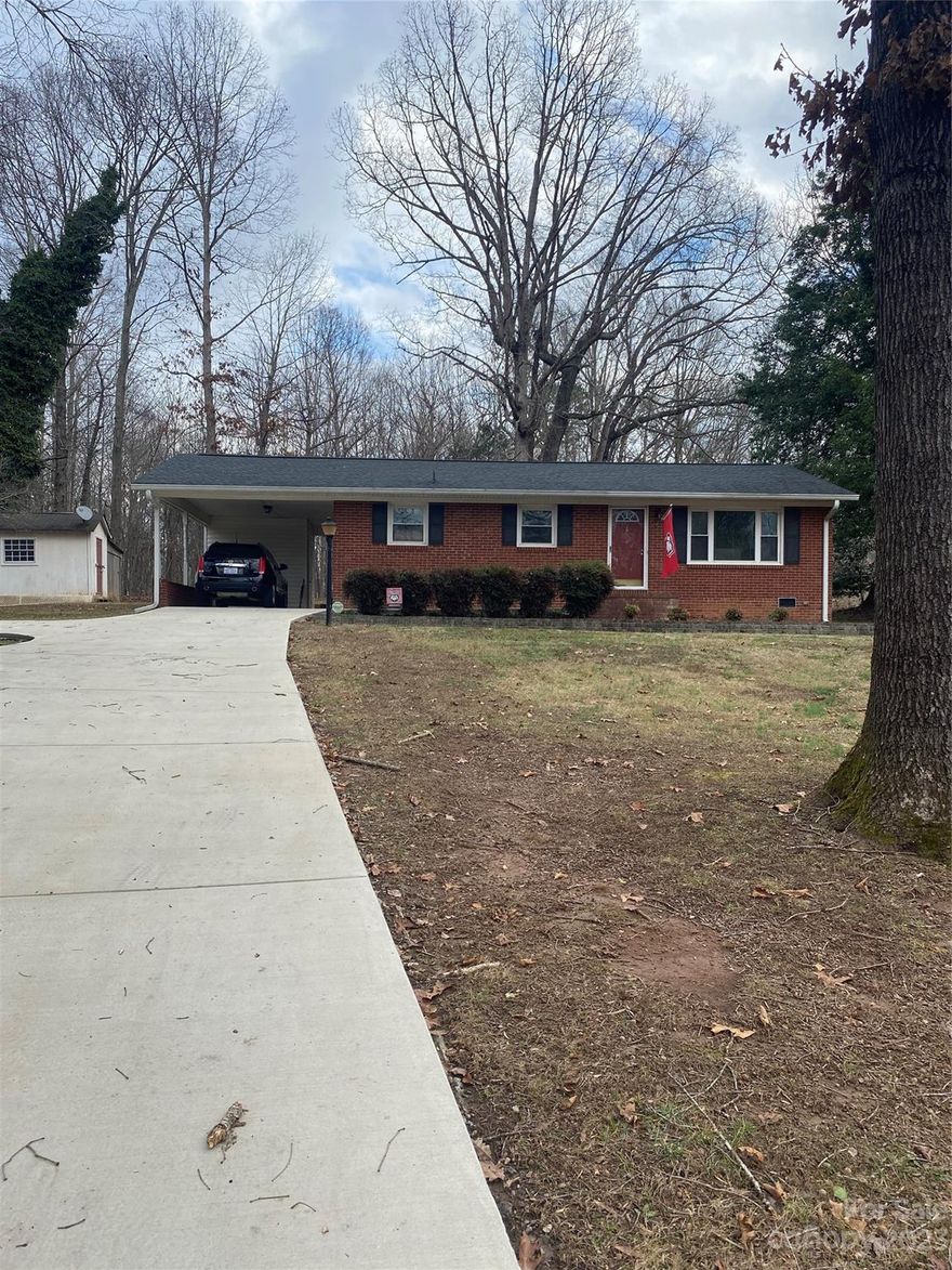 Make your New Year great with the purchase of this brick ranch with carport, detached carport and deck on back.  Completely remodeled inside with hardwoods and ceramic tile throughout.  House has surround sound throughout. Water filtration system just installed several months ago. Jetted tub in primary bath and also a walk in shower.   You will not be disappointed.  Washer and Dryer are negotiable.   Make us an offer!