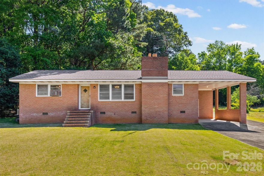 This classic all-brick ranch home on 1.37 acres is ready for someone to come and update.  Being a maintained home with a new roof in 2025 and a new HVAC in 2024, this AS-IS house has so much potential. The home sits far back from the road with a long driveway, a parking pad and a carport with a storage closet.  Out back, a spacious shed offers extra storage.  Not being in an HOA, the property has opportunity for outdoor living, pets, play equipment or gardens. Fireplace is wood-burning but has never been used and the seller is the original owner.  The window air unit is no longer in use as home as full central heating and air.  Property offers easy access to I-77, the Rock Hill Country Club and is convenient to everything Rock Hill has to offer all with a rural, country feel.