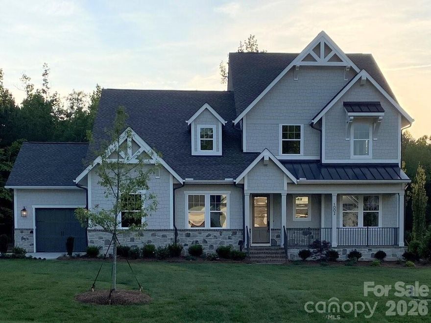 The Marin-Expanded lives large and features flexibility. The main floor features a vaulted living/dining area, open to the kitchen, with an amazing 30' wide covered outdoor living room, bringing the outdoors in. You will enjoy the feel of being outdoors and sharing space for entertaining or causal nights with family no matter whether enjoying the view from the kitchen, great room or dining. The primary suite is private and tucked away for a true retreat feel, with expansive bath and laundry room in the closet. Private Guest Suite with full bath/shower on the main level.  Upstairs are two private bedrooms and two full baths with an expansive open loft/bonus, a second laundry, plus a tech work space and unfinished storage.