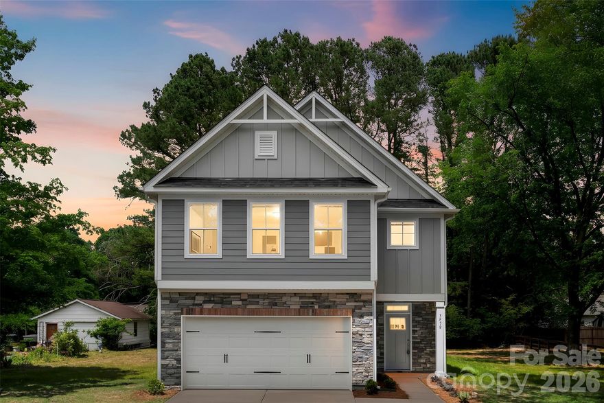 Introducing the Holly Plan by Red Cedar Homes – Elevation B – a thoughtfully designed two-story new construction home blending timeless architecture with modern finishes. The kitchen showcases Dove Shaker cabinetry, quartz countertops, a herringbone tile backsplash with satin nickel accents, island pendant lighting, and brushed nickel plumbing fixtures. Main living areas feature durable Sycamore SPC flooring, while bedrooms include comfortable carpeting. Upstairs, the spacious primary suite includes a walk-in closet and an appointed bath with white shaker cabinetry, quartz countertops, tiled shower walls, and brushed nickel fixtures. The Secondary bedrooms are generously sized with walk-in closets and share well-appointed bathrooms with coordinated tile and finishes.
Additional highlights include Carrera interior doors, brushed nickel hardware, upgraded trim package, ceiling fans in the living room and primary suite, and optional front yard sod with seeded side and rear yard. NO HOA