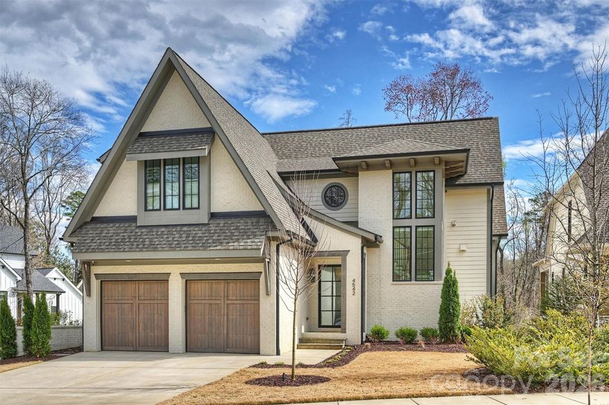 Welcome to this exceptional five-bedroom five bath lovely residence located in the highly sought after Cotswold neighborhood loaded with charm and luxury living. Beautifully designed home offers refined living in one of the city’s most desirable and established communities. From the moment you arrive, the home’s inviting presence and thoughtful design set the tone. Inside, a gracious foyer opens to bright, open living spaces, high ceilings and sophisticated finishes throughout such as Sono’s surround sound on main and lower level, Lutron shades/lights, custom drapery/blinds, new landscaping with lighting, drip irrigation in front and back yards, retractable automatic privacy shades on side porch that allow totally privacy (you can see out but no one can see in) which help provide insulation in the winter, especially with the fireplace going – super nice, incredible custom build in garage storage with epoxy garage floor, office with custom built in book shelves and Murphy bed, whole house top of the line water filtration system. The expansive floor plan features a stunning great room with wood beams in ceiling, elegant dining space and a chefs kitchen complete with premium appliances, custom cabinetry and a large center island- perfect for entertaining or everyday living. The primary suite offers a private retreat featuring cathedral ceiling a luxurious spa-style bath, brand new gorgeous custom walk-in closet that meets every girl’s dream! Each additional bedroom provides comfort and privacy with beautifully appointed bathrooms ideal for family and guests. Step outside to enjoy privacy fence, multiple outdoor living areas including retractable automatic smart privacy screen shades, fireplace, lower level screened in porch perfect for relaxation and entertaining in every season! Located minute for Cotswold Village, South Park, Uptown Charlotte and top-rated private schools. What a opportunity to call this turn key your home!