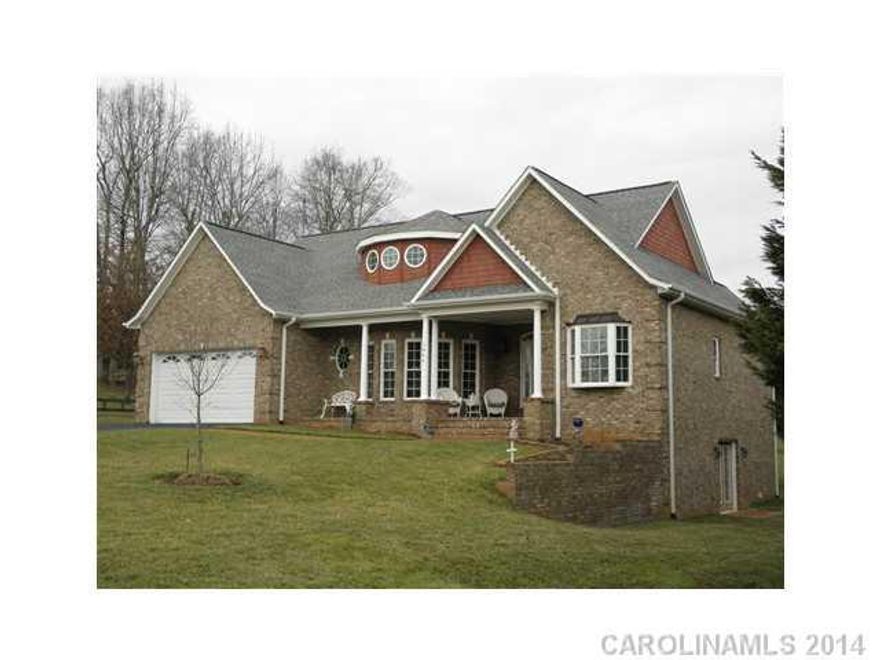 One look and you will be sold. Custom ranch w/ basement, crown molding & hardwood floors throughout, Open floor plan, granite counter tops and breakfast bar. Nice living room, formal dining room, lower level family room, exercise room, game room and kitchenette w/ full bath and storm shelter / storage. Large deck with patio and beautiful front porch.  Over sized brick, shake and vinyl siding.