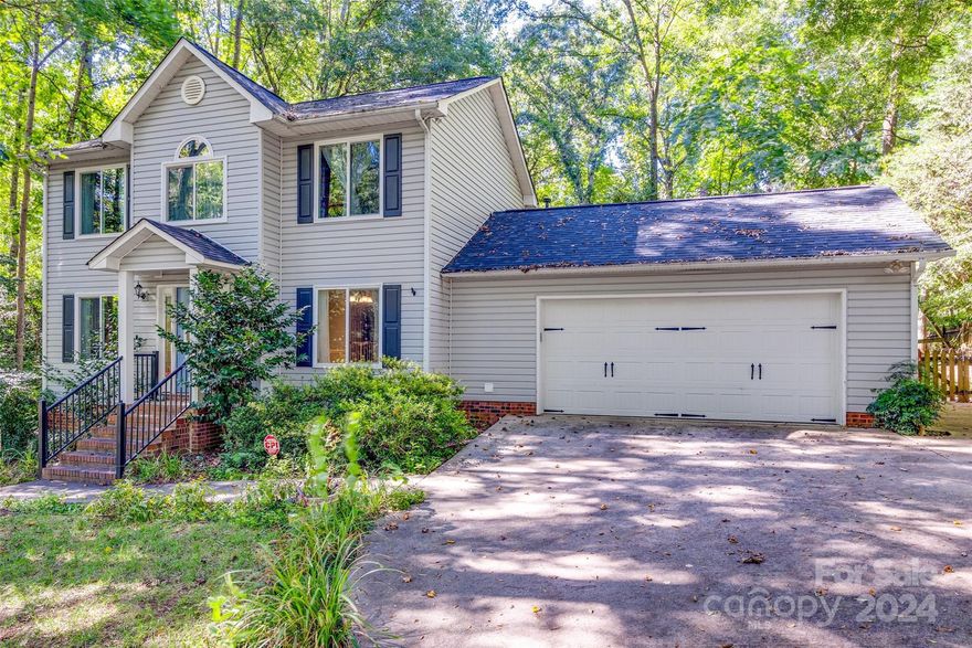 Nestled on a peaceful cul-de-sac street, this charming home offers tranquility and privacy on it's wooded 1/2 acre lot. New roof in 2024! The majority of the home was freshly painted in 2021, and most windows (24) were replaced this year, ensuring a modern and well-maintained interior. AC unit was upgraded to a zoned system with updated ductwork in 2017 and has been regularly serviced every six months. Crawlspace has been encapsulated with a dehumidifier, also added in 2021, adding to the home's efficiency. This home features LVP flooring throughout the bedrooms, office, living room, and kitchen, new tile floors in the downstairs bathroom, and carpet only on the stairs for added comfort. The expanded patio area in the backyard features a built-in gas line, perfect for grilling and outdoor entertaining. Located in the top-rated Fort Mill school district and with easy access to I-77, this home offers convenience and quality living. Don’t miss out— this gem won’t last long!