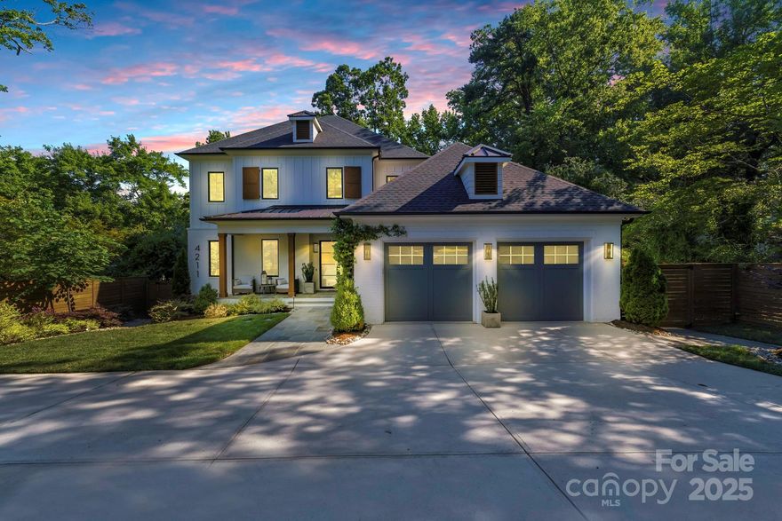 This ultimate example of New South Modern Farmhouse blends craftsmanship, functionality, and style with entertainment-focused amenities. High-end finishes, polished décor, and state-of-the-art tech set it apart from other offerings in Cotswold. The backyard oasis, nestled among mature oaks, features a heated saltwater pool, outdoor kitchen, large hot tub, screened porch w/ gas fireplace & Bromic heaters for year-round comfort, a secluded patio w/ wood-burning fireplace, bluestone hardscapes, turf lawn, and lush landscaping w/ elevated fencing for ultimate privacy. Inside an open main level that flows through the centralized Living Room, Chef’s Kitchen, Dining Area, and luxe Primary Suite w/ exposed beams, huge walk-in closet & spa-like bath. The most unique glass-enclosed Whiskey Room sits under a grand staircase leads to 3 bedrooms w/ full ensuite baths.  Designer furnishings & décor are available for purchase. Ideally located just minutes from SouthPark’s vibrant dining & shopping.