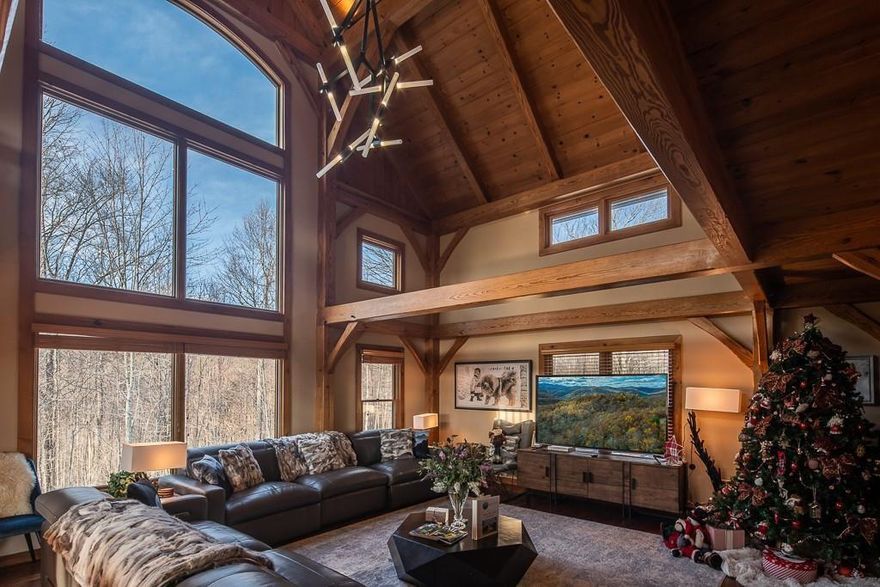 Beautiful Timber Frame Home features Open Floor Plan w/Long Range Views. Interior designed by Architect/Interior Designer w/all new decor. Situated on gentle 2.09 acre lot w/firepit. Soaring Stone Fireplace w/Custom Hand Carved Mantle, Tiger Walnut Floors throughout, Tongue & Groove ceilings, Gourmet Kitchen w/Stainless Appliances, Granite Countertops, Large Loft w/lots of seating & game area. Electric Fireplaces added to BRs & loft. Built in Bunk Bed added to one room. Detached 2-Car Gar w/Guest House above w/full bath & kitchenette. Smaller garage under home perfect for UTV/Golf cart. Headwaters at Banner Elk is a beautiful subdivision w/many amenities, including lakes & several parks! Clubhouse features gourmet kitchen, large great & dining rms, game rm, fitness center, tennis & home theater. Close to the quaint town of Banner Elk, plus skiing, hiking, restaurants, concerts in park, plays, Grandfather Mtn, Blue Ridge Parkway, etc. 7 Day Min Rental Restriction. Watch Virtual Tour!