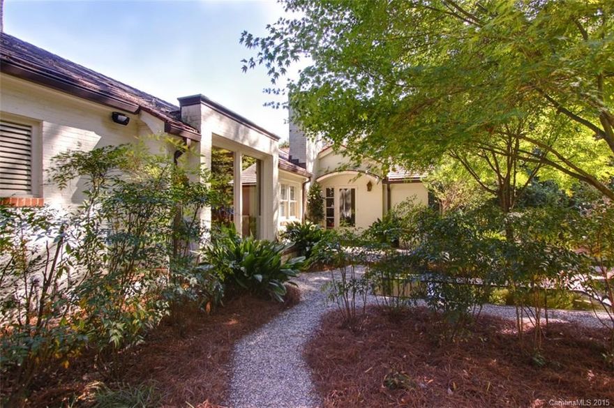 A true Dilworth Gem. Walk to Latta park, greenway, shops on E. Blvd & uptown. Beautifully remodeled home has open plan, great for entertaining. On the 2009 Mint Home Garden tour & was photographed by Better Homes & Gardens. Tons of built-ins, screened porch, irrigation front & back, beautiful landscaping, electric gate with brick wall that surrounds backyard, tile roof, travertine & hardwood floors (some heated), 16ft master closet, cooks kitchen, 9ft ceilings make this a one of a kind.