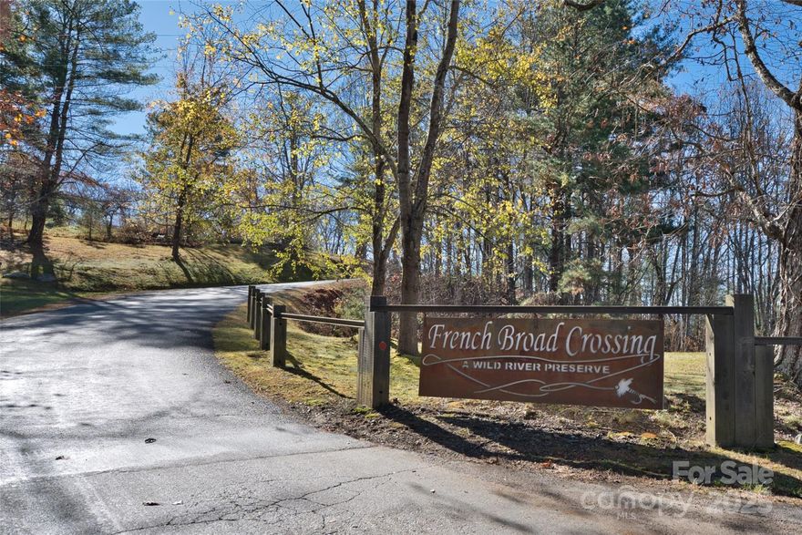 This 1.64-acre lot in the scenic French Broad Crossing gated community offers an ideal location to build your dream home. With a septic permit in place and a shared well (dug, but no pump installed yet), the property is ready for development. Enjoy a peaceful setting, and nearby access to the French Broad River for outdoor activities like kayaking and fishing. The community features hiking/ATV trails, a fitness center, clubhouse, pool, hot tub, and river access. Don’t miss the chance to create your perfect home in this beautiful, nature-filled setting! Seller is motivated!