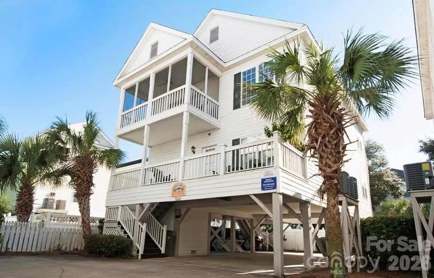 Welcome to your dream coastal getaway! Perfectly situated between the Surfside and Garden City Piers, this 4 BR, 4 BA beach house offers the ultimate blend of relaxation and investment potential. With sleeping space for 14 guests, this home is a proven income-producing vacation rental or an idyllic second home for those who crave the beach lifestyle.  Key Features: Unbeatable Location – Just steps from the beach with ocean views from the dining room. Move-in or rental-ready, all furnishings convey.  Outdoor Living Spaces – Enjoy the sea breeze from the screened balcony, screened back porch, or inviting front porch. Community Pool Access – Cool off in the shared pool, perfect for lazy summer days. Spacious & Comfortable – 4 large bedrooms, each with its own bath, ideal for hosting family & friends. Whether you're looking for a rental investment or your own private beachside retreat, this home offers the best of both worlds. It's your turn to own a piece of paradise! Come and get it.