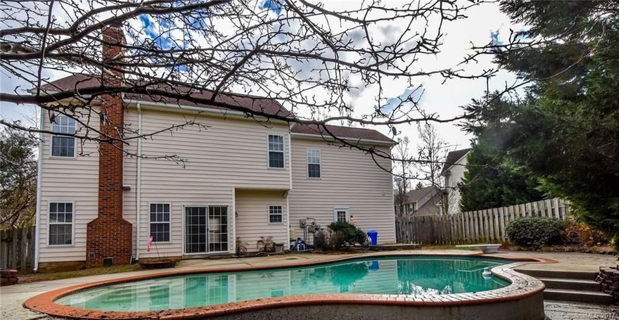 Partial brick, 5 bedroom home with an apartment on main.  Apartment bath handicap accessible, both front and back door for easy access to apartment. Apartment has full kitchen with SS appliances. The pool and fenced yard make this home a private retreat. Open floor plan, freshly painted, new carpet in family room, large kitchen with island, laundry room, new light fixtures on first floor. Huge Owners retreat. Price Adjusted! $245,000. Close to shopping, hospital, restaurants! This will go soon!