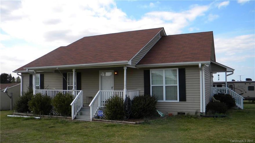 Superb country living, wonderful rocking chair front porch, great cleared area for gardening those wonderful fresh vegetables, a  42 x 21 barn doubled in size,  cleared space for a soccer field or baseball field too.  Room to store all your vehicles, tractor, cars, RV's and more.   Just minutes from I-77.