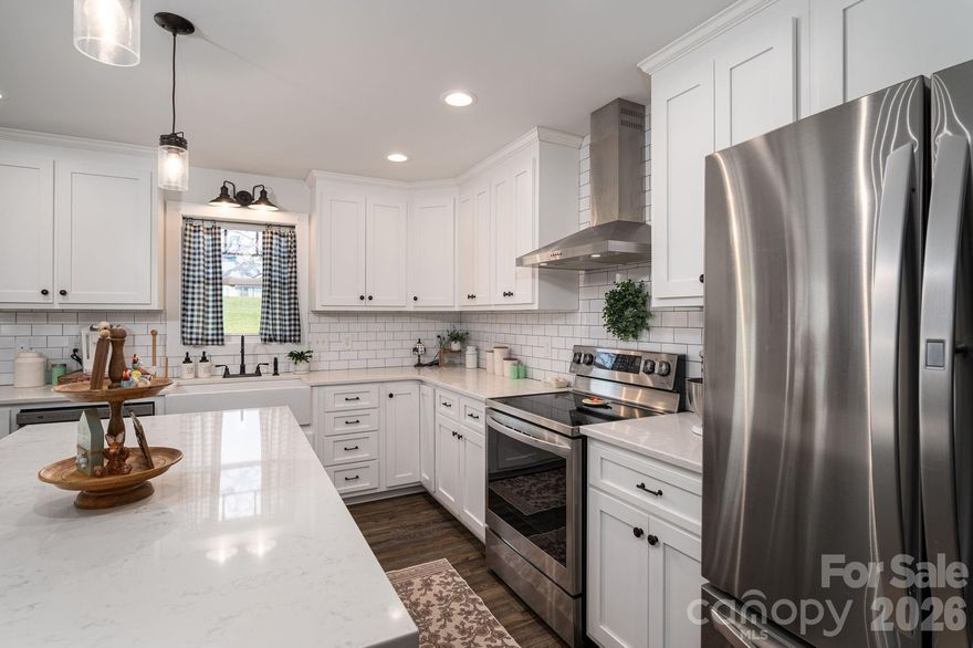 UPDATE 4/17/2026 SELLER OFFERING $5000 towards CLOSING COSTS or RATE BUY DOWN!!!!  Welcome to Farm house style on a spacious 3/4 of an acre in sought after western Lincoln County! As you walk-in the front door you can't help but feel the warmth of the beautiful dark luxury vinyl plank flooring which is perfectly balanced with light colored walls, shiplap accents, white kitchen backsplash and counter tops and white shaker kitchen cabinets.  The living room boasts vaulted ceilings which makes your open Kitchen-Dining-Living area feel plenty spacious for those large family gatherings.  It has a faux fireplace with an electric heater complimentary of the farmhouse vibe.  Also tucked away off of the living room is a small office perfect for working from home!  The split bedroom floor plan allows privacy for all and even would be perfect for multigenerational living.  A bathroom accommodates both bedrooms on that side of the house and a beautiful barndoor has been installed to close off the entire left side of the house if desired.  Entering from the two car attached garage with an attic pull down you will find a lovely mud room/laundry room where you can drop the dirty shoes before entering your quaint home.  Off the dining room you can head out back to your large deck and enjoy the privacy of a fenced back yard.  If you have ever dreamed of having your own fresh eggs, this could be the perfect place for you as the chicken coops and chickens are negotiable!  The hardest part is getting started and here you can walk right into collecting your own fresh eggs.  As is if this isn't ideal enough, all appliances convey as well, even the washer and dryer!  Don't wait to schedule your appointment to see this home!