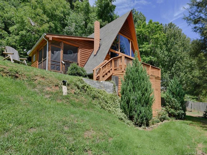 This classic cheerful A Frame boasts a wonderful wall of windows to let the light pour in, lovely mountain view, charming screened porch and mountain ambiance.  It's open floor plan, renovated bath and cozy loft bedroom area make this affordable home tempting.  With easy access to Waynesville, Maggie Valley, Lake Junaluska, and Cherokee, this house will appeal to mountain getaway seekers or full time residents.