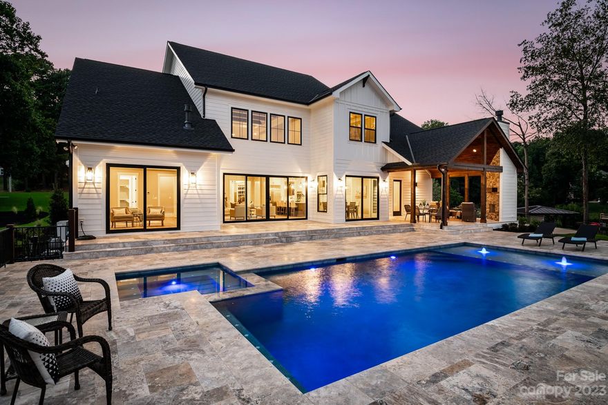 New Construction! Stunning custom home on over an acre on the shores of Lake Norman.  Breathtaking views from every room. 4BR 4.5Bath. Large bonus room with wet bar & addl flex rooms. Office on main floor. 48” commercial gas cooktop with 1200cfm commercial range hood. 48” built in Fridge. 3 fireplaces including wood burning fireplace with gas starter under covered patio. New dock. Gunite/pebble tech heated saltwater pool & spa. Silver travertine pool deck & patio. Pool bath. Spa like master bath with heated floors and 4 valve Moen talk/touch/app control smart shower. Instant hot water with recirculating line throughout home. Hallmark oak floors throughout living areas. 8’ solid core interior doors. Commercial epoxy garage floor. Quartzite and quartz counters. No expense spared on this home. Large flat 1+ acre lot and 200’ of water frontage with 190 degree views! 2 grandfathered boat ramps on property. No HOA. Just minutes to I-77 & Lake Norman High School.