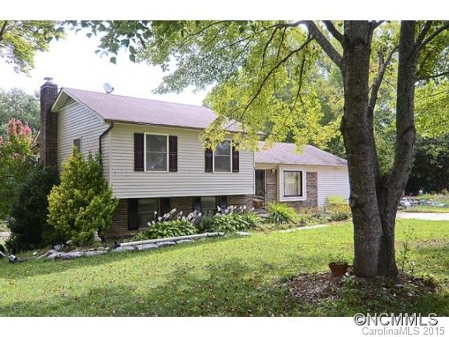 Convenient to I-40! This split level has 3 bedrooms, 2 bathrooms, large living room and a finished den in the lower level with a wood stove. A new roof in 2003 and new heat pump in 2010. With a little more TLC this will be a great family home. Please call to make your appointment today.