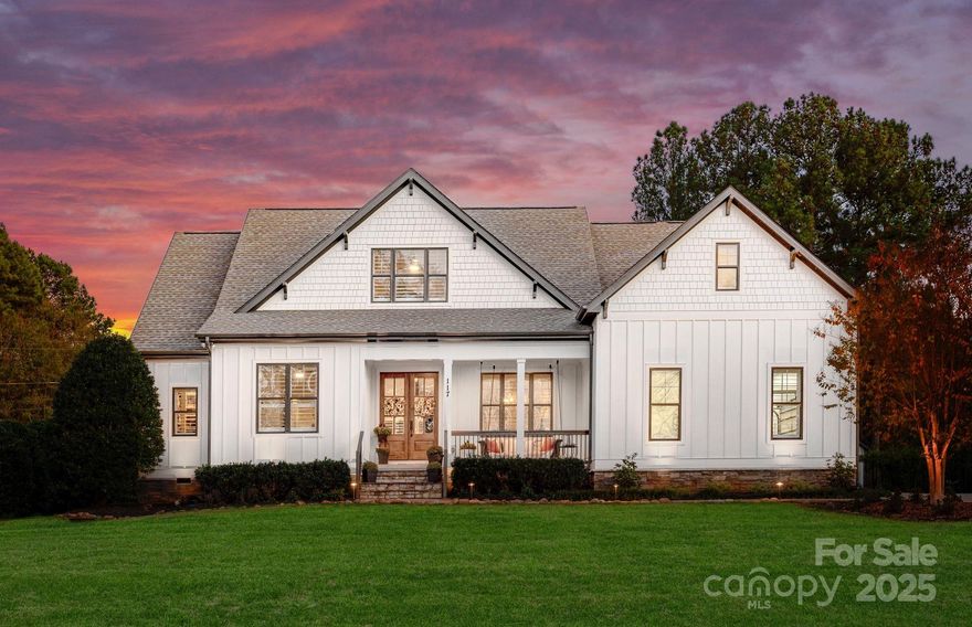 Welcome to 117 Yellow Jacket Circle—an exquisite 4BR/3BTH modern masterpiece seamlessly blending architecture with your private oasis. The newly renovated kitchen is a fusion of unique aesthetics and functional elegance. Newly installed whole house water system in addition to the extra purification at the kitchen sink. Living spaces effortlessly extend to an outdoor haven with a saltwater pool, spa, and smart technology. The travertine patio, gas fire pit, and two fire bowls create the perfect ambiance. A screened porch with a wood-burning fireplace and the WinDor Multi-Slide Door offer California-style indoor/outdoor living.  Craftsmanship shines, from the vaulted great room to the renovated primary suite. This turnkey home features a private office, refinished hardwood floors, and fresh paint. Embrace luxury living in Mooresville without compromise—your dream home awaits at 117 Yellow Jacket Circle!