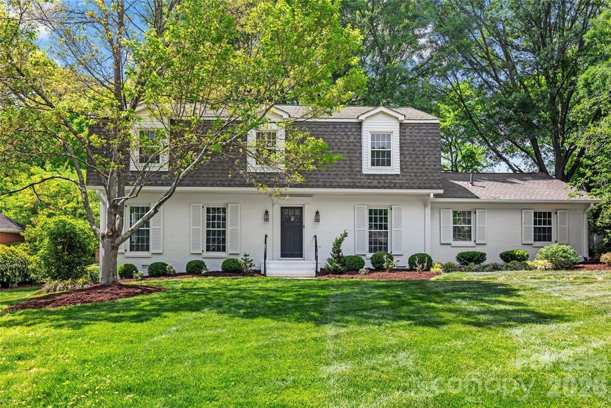 WELCOME TO LANSDOWNE!  Situated on a generous .36-acre lot, this move-in ready two-story home offers the perfect blend of comfort, functionality, and lifestyle.  Thoughtfully designed for both everyday living and effortless entertaining, the home features four bedrooms, two full baths and one half bath.  The main level flows seamlessly with a bright living room, dedicated dining area, and a spacious family room anchored by a cozy fireplace. The kitchen is well-appointed with stainless steel appliances, an island, and ample space for gathering.  Venture outside and elevate your entertaining on the expansive deck overlooking an exceptional backyard complete with low-maintenance turf, a private putting green, and a dedicated playground area.  Additional highlights include an attached carport with storage. Convenient location just minutes from shopping, dining, and a quick commute to Uptown.