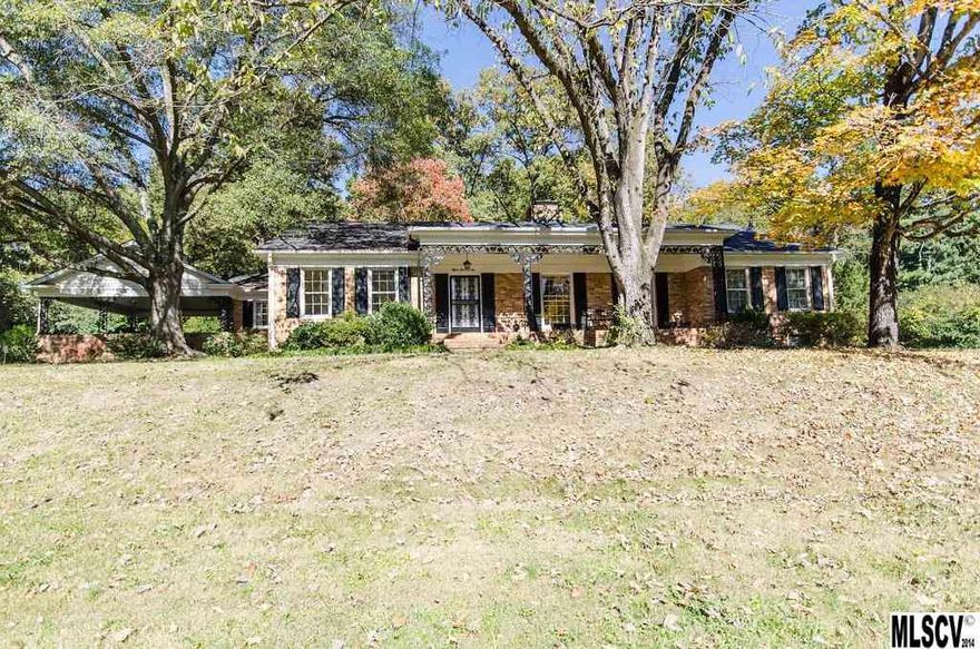 Classic 1950's 1.5 story home in desirable Forest Hills subdivision! Located in the Lincoln Country Club area! Home has been freshly painted inside and out. Huge 2.4 acre lot with a lovely, wooded back yard. The den has solid walnut paneling, built ins and a gas fireplace. Large sun room. The master bedroom is on the main level along with 2 additional bedrooms with a full bath on this floor. Upstairs has 2 bedrooms, a full bath, and a large hallway perfect for a rec room or play room.