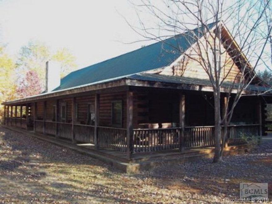Spacious log home in private setting! Convenient to I-40, Exit 113. Home features 3 bedrooms on main level with 2 additional rooms waiting to be finsihed upstairs.Large master bedroom with fireplace, 3 closets.Hardwood floors, white pine interior, work island in kitchen.Private backyard with many flowering plants & trees.Full basement with drive in garage entry.Main level garage also. Priced below tax value! $165,000. 121 Lloyd St.