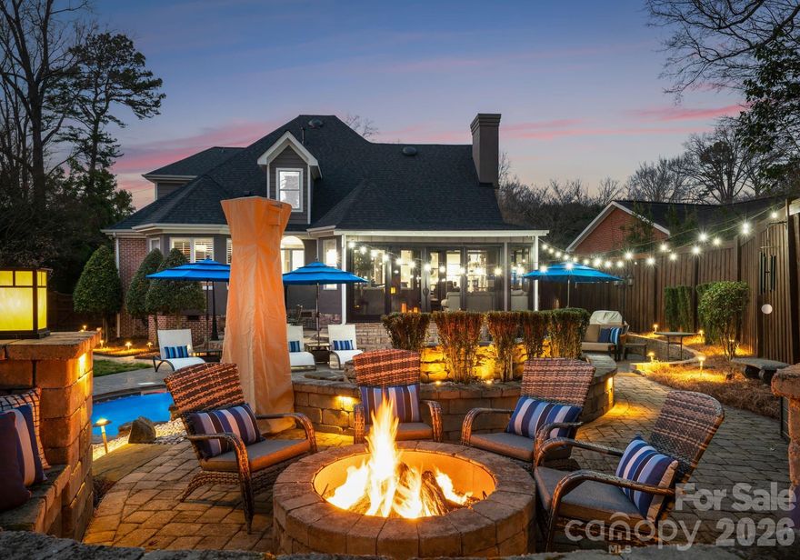 Welcome home to 141 Sardis Ln. A quiet estate atmosphere, where privacy, luxury & style come together in perfect harmony. An elegant gated entrance & a beautifully paved driveway lead you to a yard where the sellers have spared no expense at creating an inviting welcome. Enjoy all of the Carolina seasons in the comfort of your backyard, featuring an 8-foot privacy fence, an inground heated pool with waterfall feature, & gas fire pit perfect for entertaining or relaxing. Inside, you’ll find that living luxuriously comes effortlessly, as almost every detail of the home has been renovated/upgraded. The heart of the home features an open-concept family room & kitchen area, equipped with stunning counters/backsplash & upgraded appliances including a Wolf cooktop & Sub-Zero wine storage. The main level features a spacious primary suite that opens to the backyard. This suite includes a modernized bathroom equipped with dual vanities, & generous walk in closet. The second floor features two large sized bedrooms, recently updated full bathroom, & an additional room with a closet, large enough to serve as a bonus room or extra bedroom. Ideally situated in a central location, 141 Sardis Rd is close to Southpark & just a short drive to Uptown. Minutes away from shopping at the Arboretum, Cotswold & downtown Matthews. Countless details- you truly must see in person to fully appreciate!