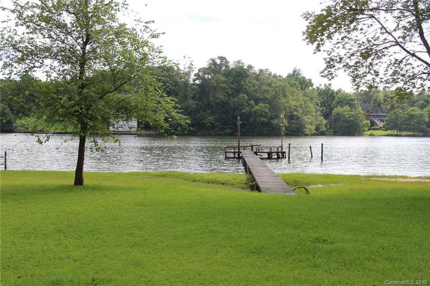 Super level lot, overlooking wide channel of Little Allison on Lake Wylie. fabulous view, excellent area of the lake, Clover schools and low county taxes. Spacious 1.7 acre lot, surrounded by trees for privacy.  Located on a street with nice custom homes.  Property currently has a 2 bedroom cabin on it, and can be used as a "weekend retreat." Details appear in duplicate MLS listing #2167043 (classified as Residential.)   Pier is in place.