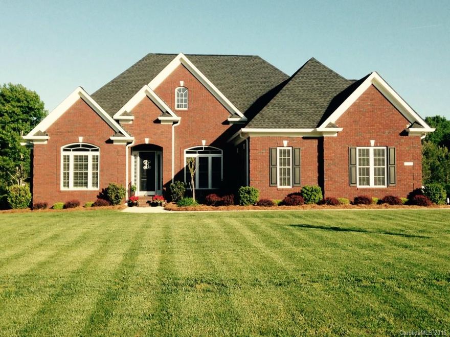 Beautiful, hard to find full brick ranch on an acre lot with gorgeous grass & landscaping! Custom home with gorgeous features including hardwoods, stone fireplace, amazing lighting fixtures, high ceilings, granite in kitchen & baths, tile backsplash, and custom plantation shutters throughout! Home is like new and immaculate. Owner had this house custom built! Very impressive!