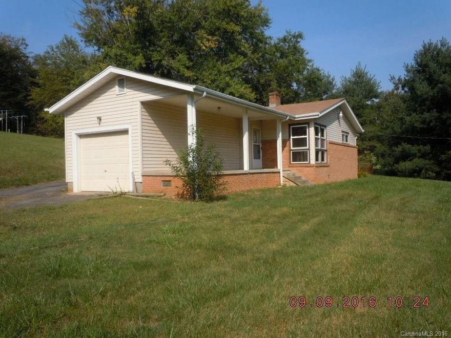 This home offers easy access and lots of room on this over-sized sloping lot. Lovely hardwood flooring and  newer windows. The home needs renovating/ updating and cosmetic work. All offers require Proof Of Funds.